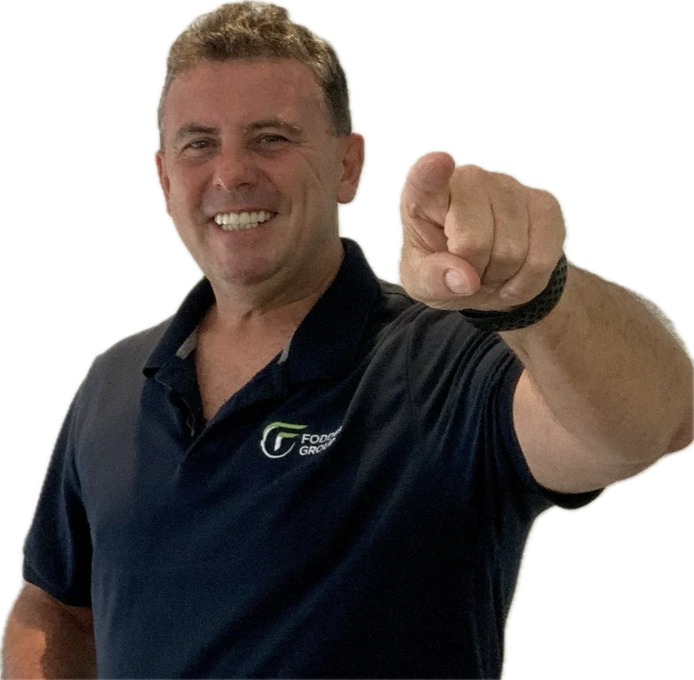 Chris Levick, founder of Fodder Group, pointing toward the viewer